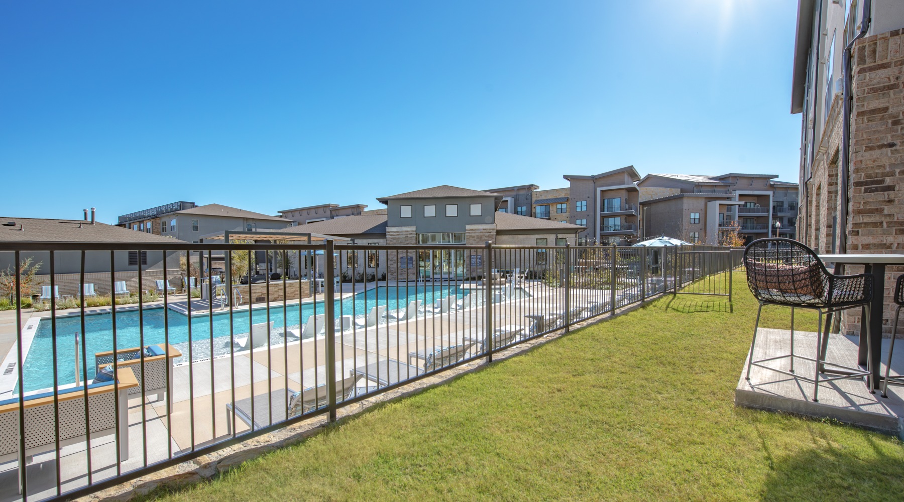 pool view with yard, patio and sunshine