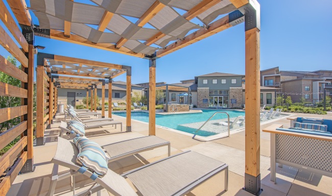 pool with chairs and side tables