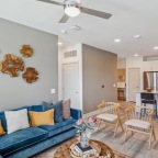 a living room with a blue couch