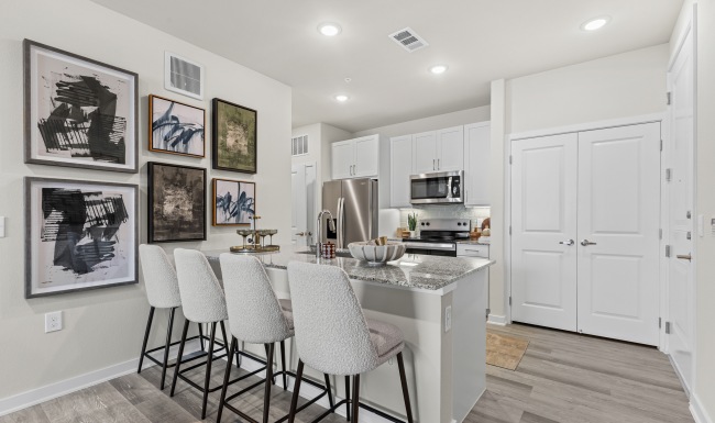 Chef-inspired kitchens a kitchen with an island and chairs