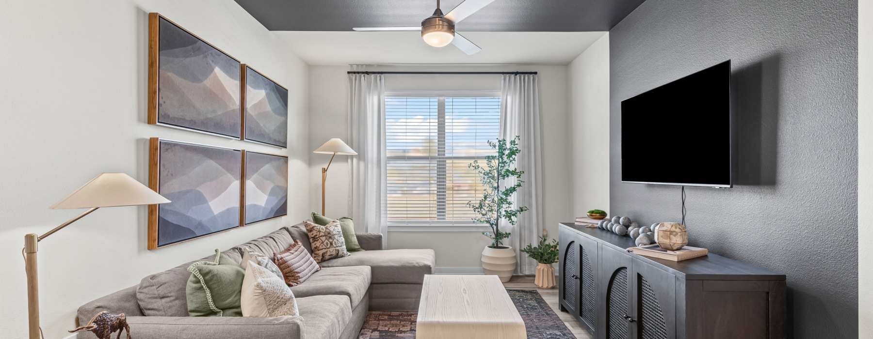 Spaces created just for you living area with couch looking into kitchen